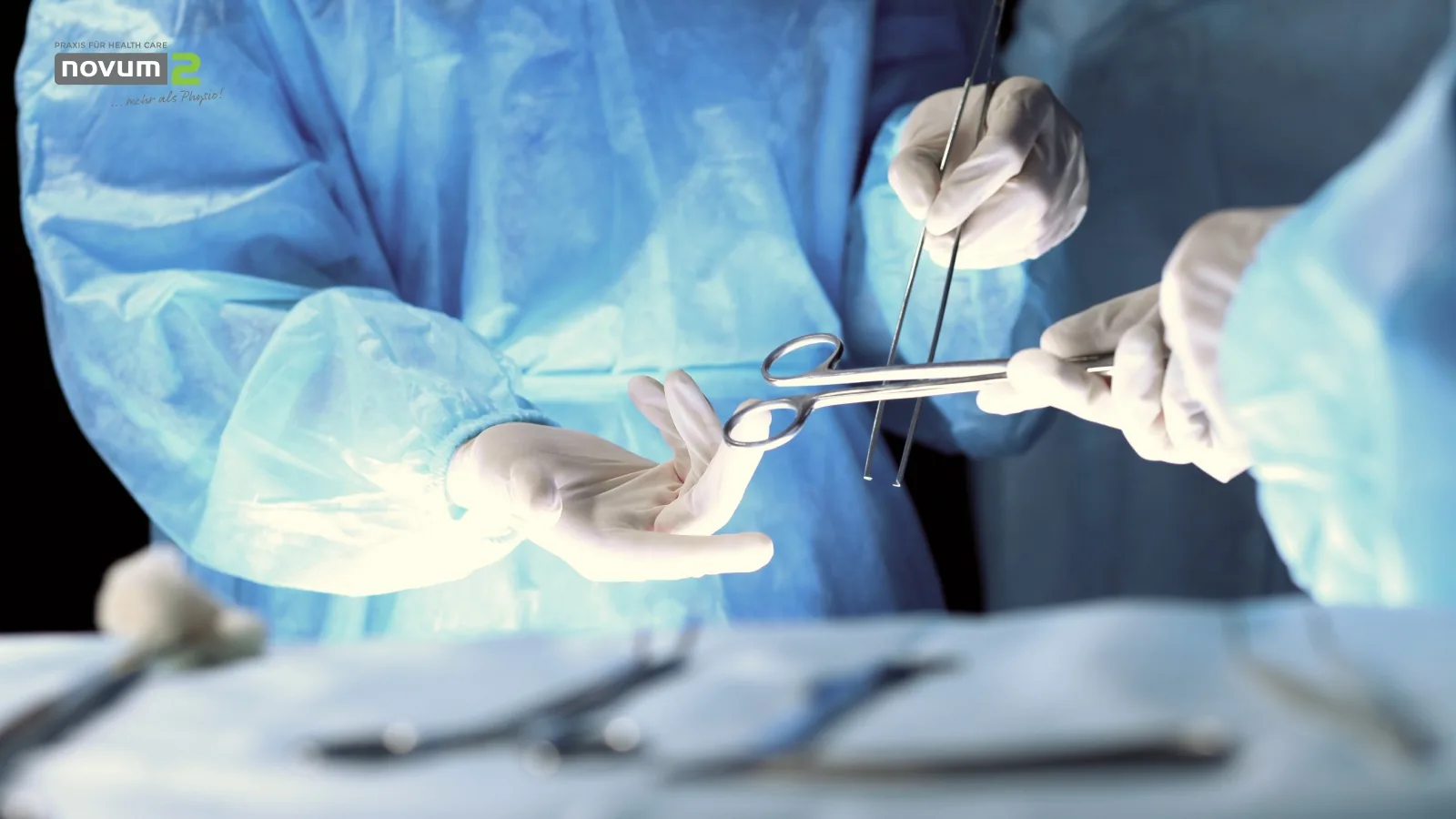 Surgeons in surgical clothing performing an operation