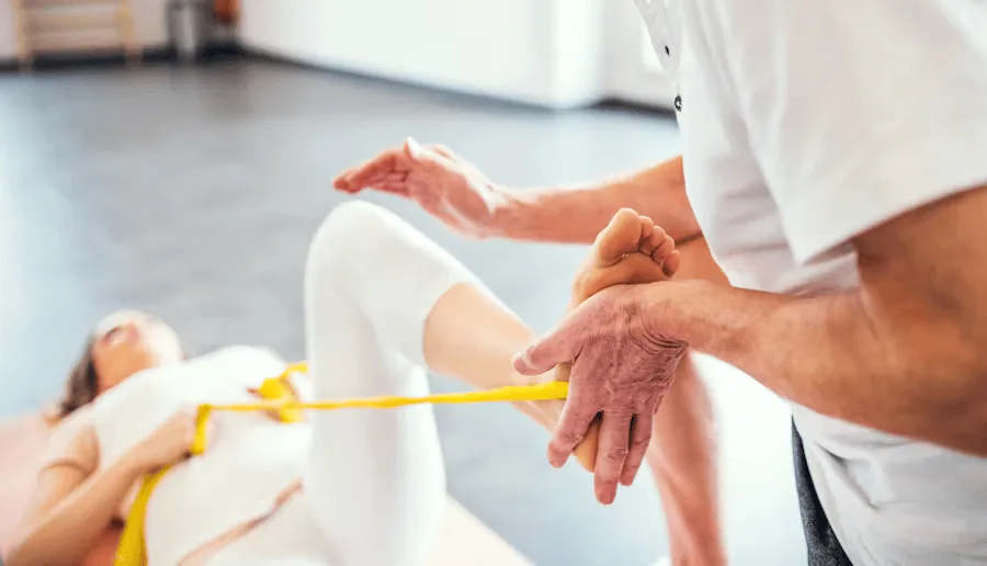 Woman receiving physiotherapy for her sciatic pain.