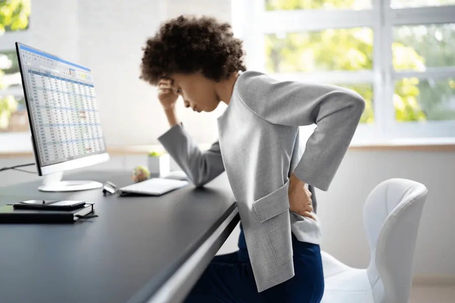Woman with sciatic pain in the lower back.