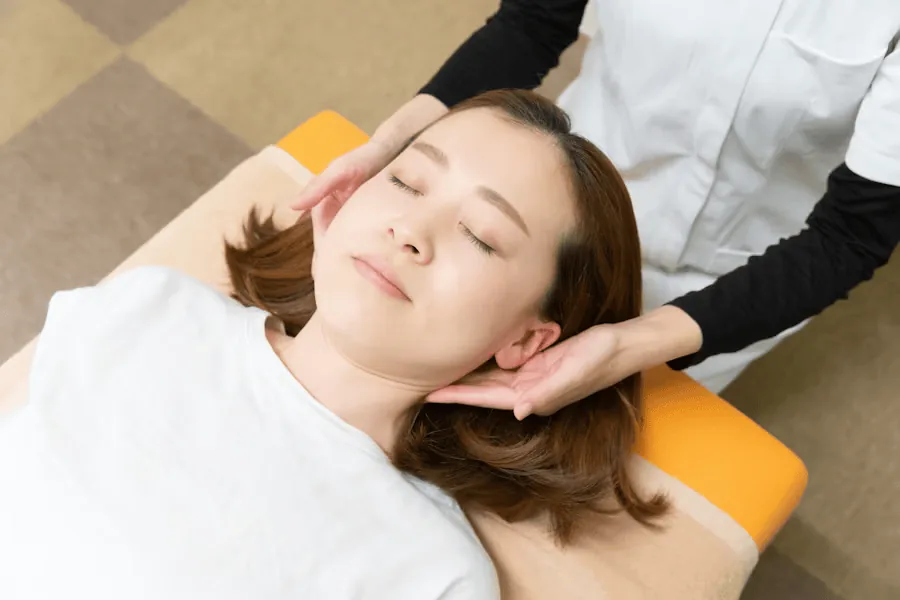 Woman receiving physiotherapy for the treatment of jaw pain.