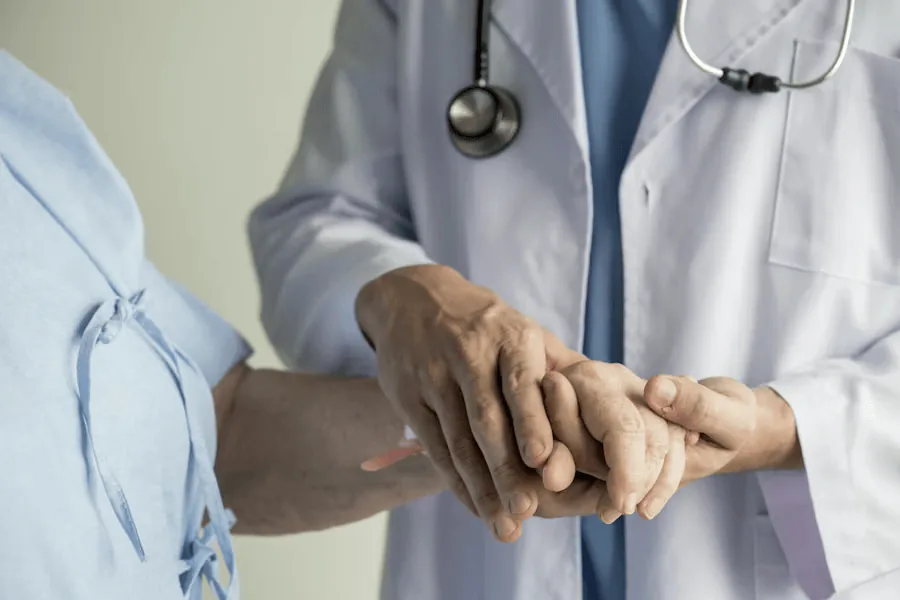 A doctor examines the tingling in a patient's hands.